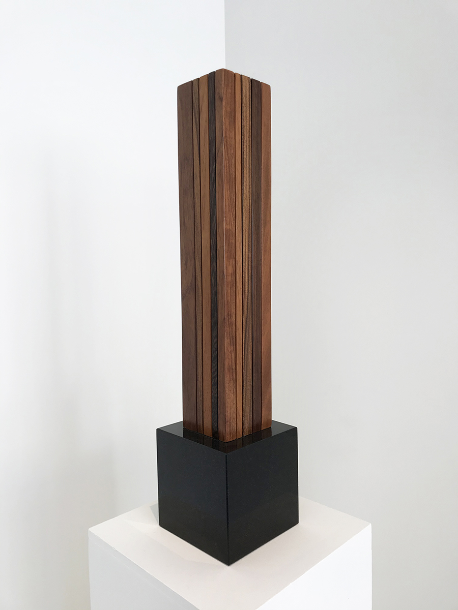 Untitled, 1999 mixed wood with stone base 26 x 4 x 4 inches